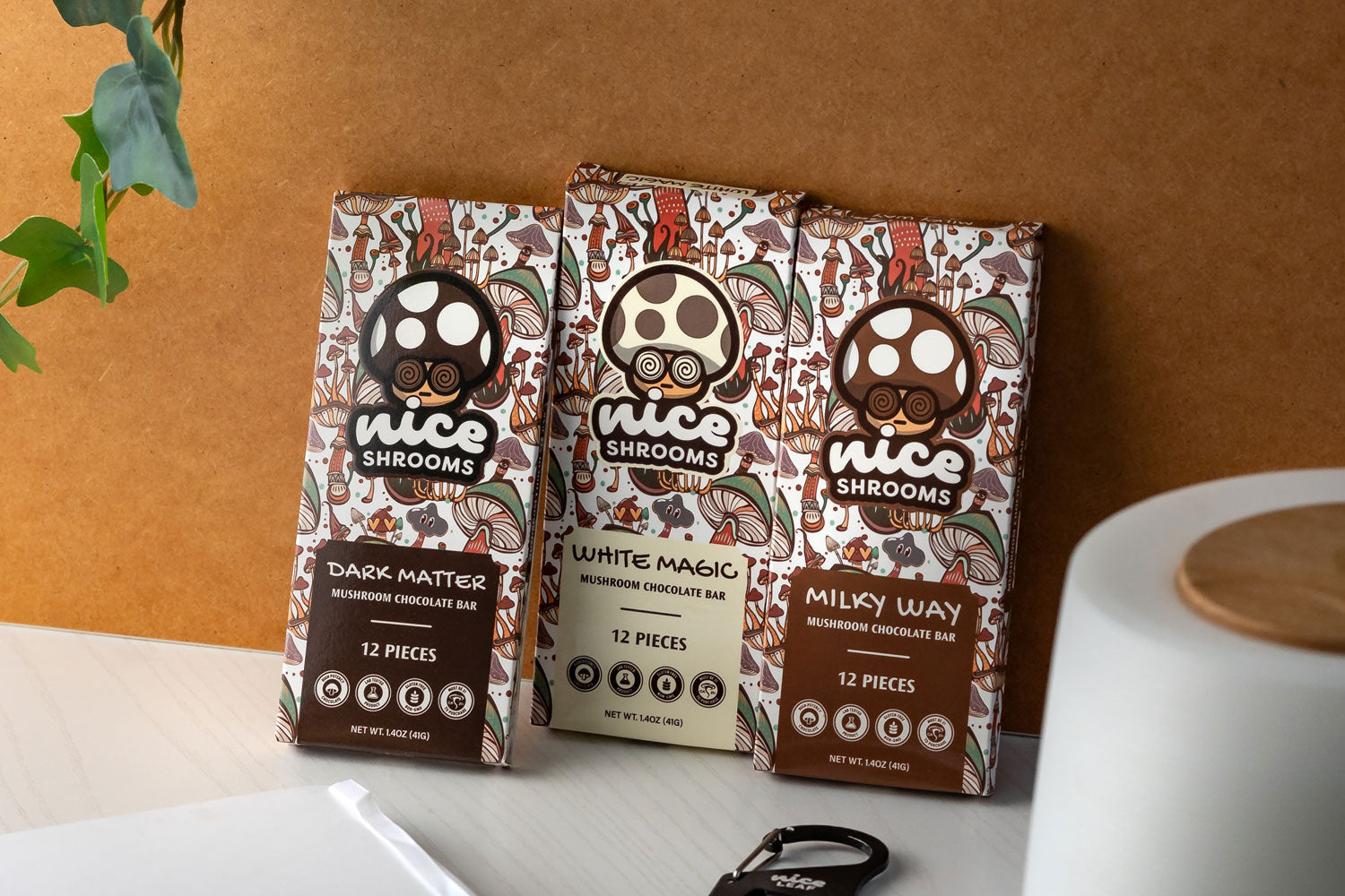 Nice Shrooms chocolate bars displayed on an orange wall