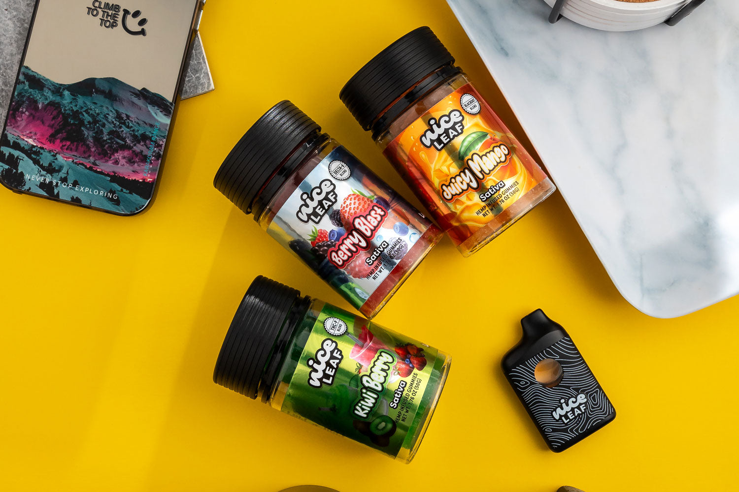 assorted nice leaf gummies displayed on a yellow table